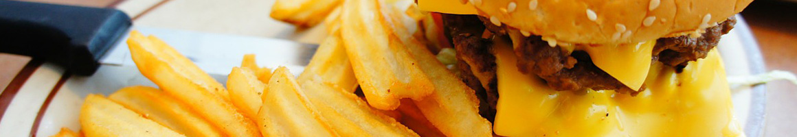 Eating American (Traditional) Burger at Schoop's Hamburgers of Hobart restaurant in Hobart, IN.